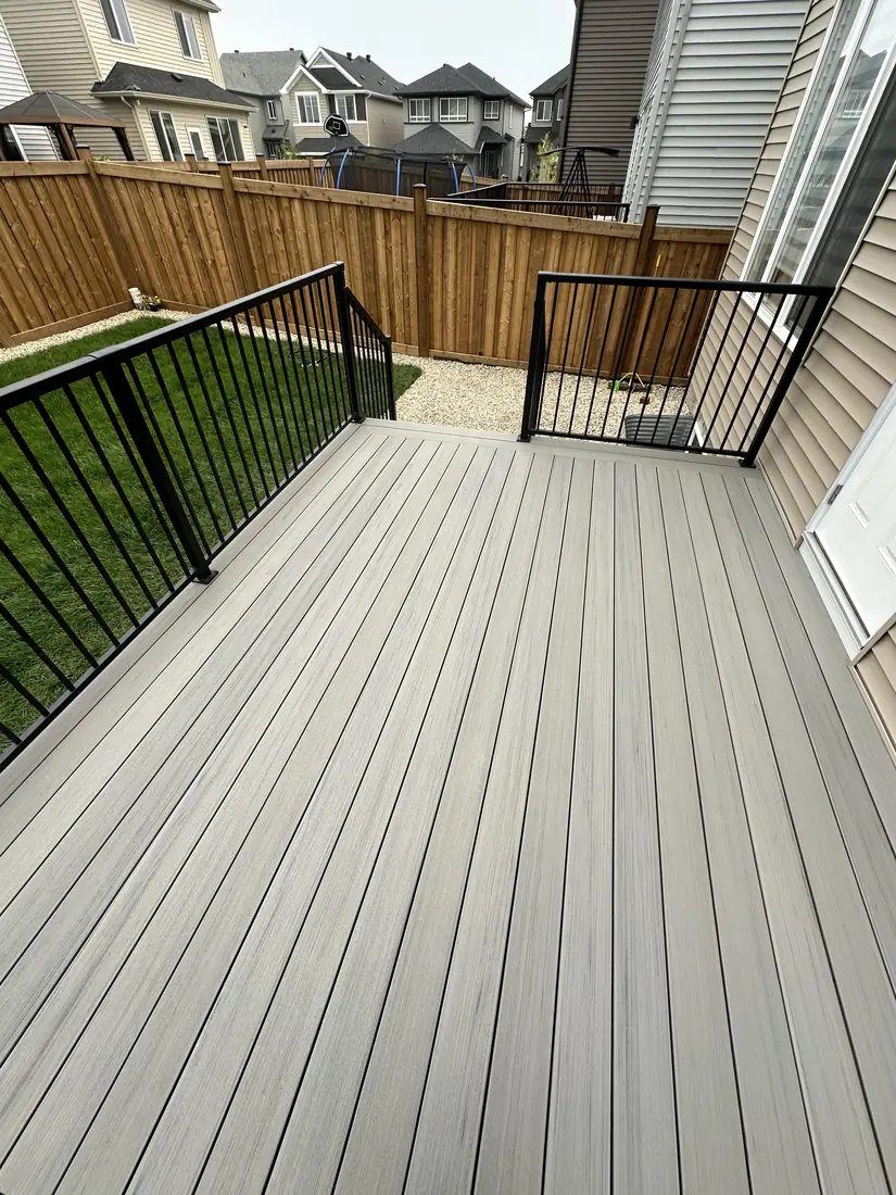 TimberTech Sea Salt Gray composite decking with picture-frame border on an Edmonton deck — TrueBlue Builders